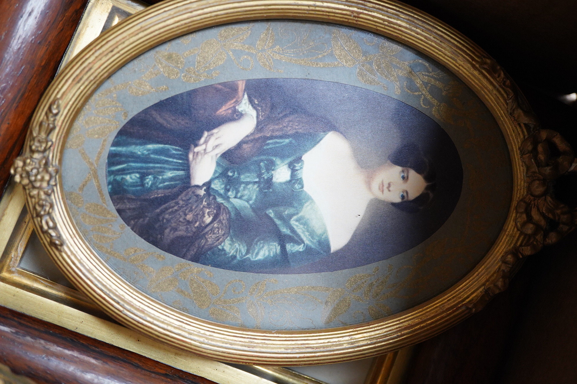 A collection of watercolour and printed miniatures and frames to include: 19th century and later oval silhouette portraits, one rosewood framed, various ebonised and partially gilt frames and a comical watercolour, hunti